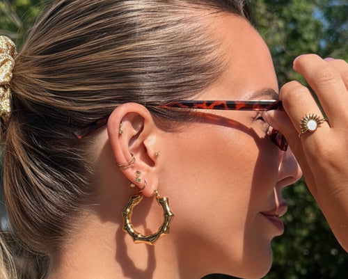 Aurora Bamboo Gold Cuff Bangle worn on model's wrist