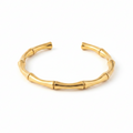 Aurora Bamboo Gold Cuff Bangle on pure white background