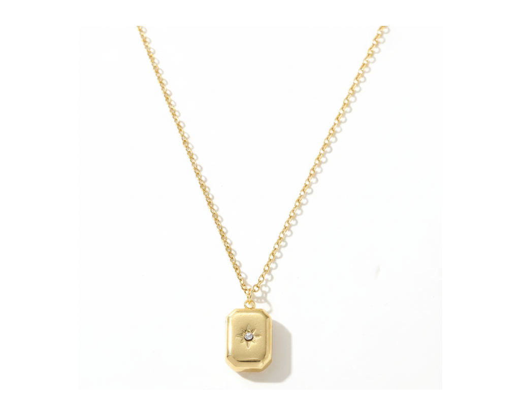 Gold Star Locket Necklace on pure white background