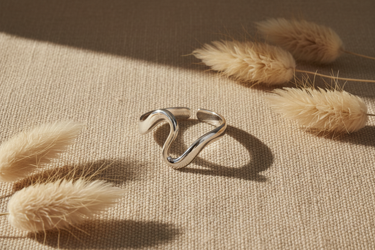 Silver irregular open ring on boho linen background