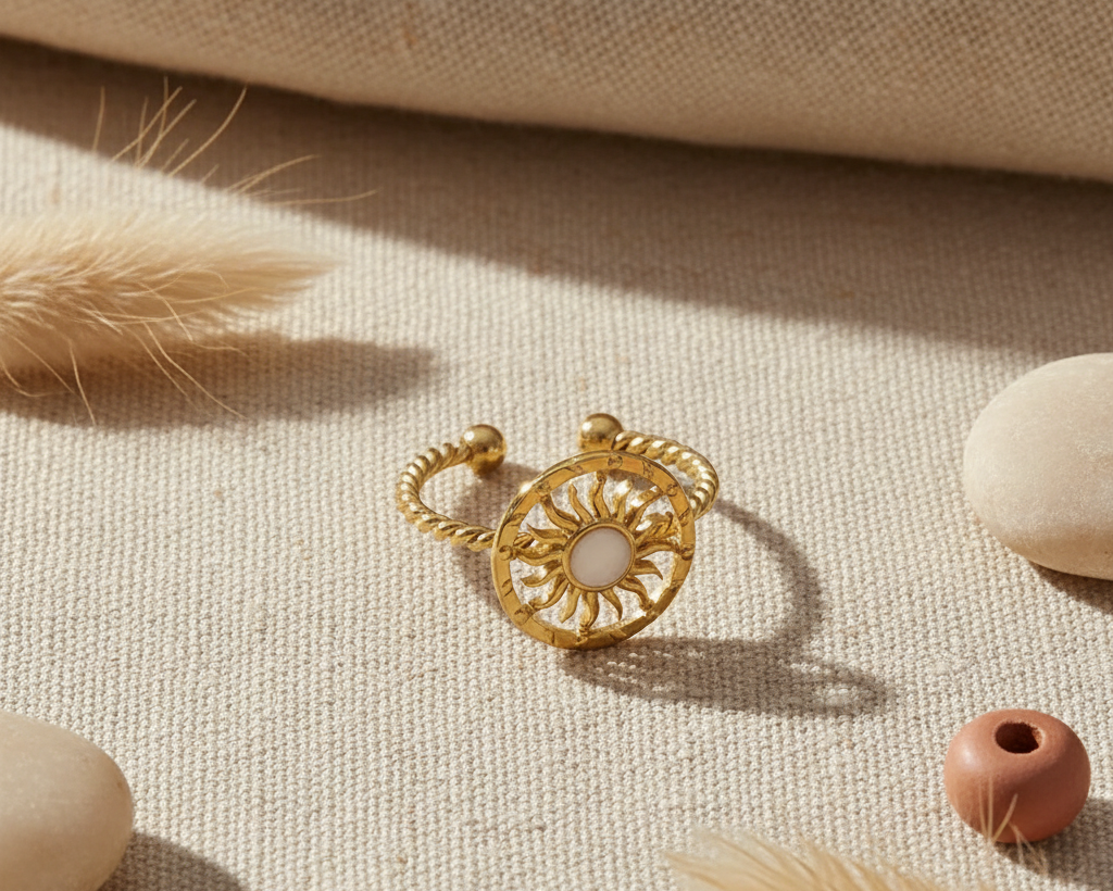 Gold sun ring on boho linen background