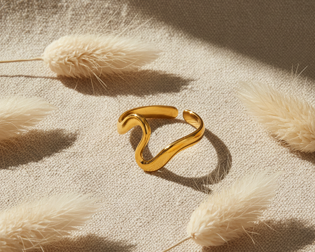 Gold irregular open ring on boho linen background