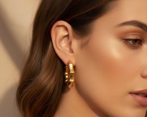 Model wearing Bamboo Hoop Earrings Gold