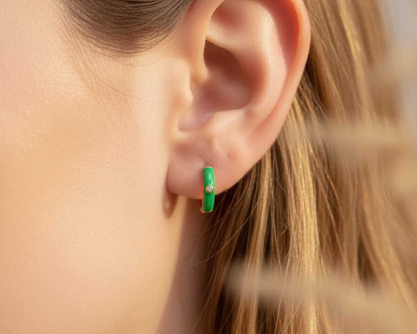Model wearing Glow Huggie Hoops Green